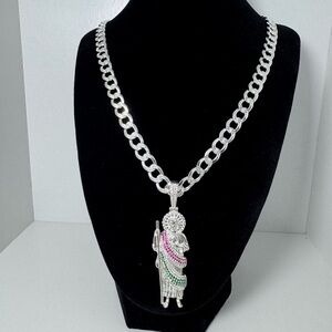 A Cadena cubana con dije de San Judas Tadeo con piedritas plata925